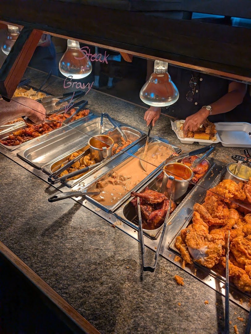 Family buffet spread with salads and hot dishes.